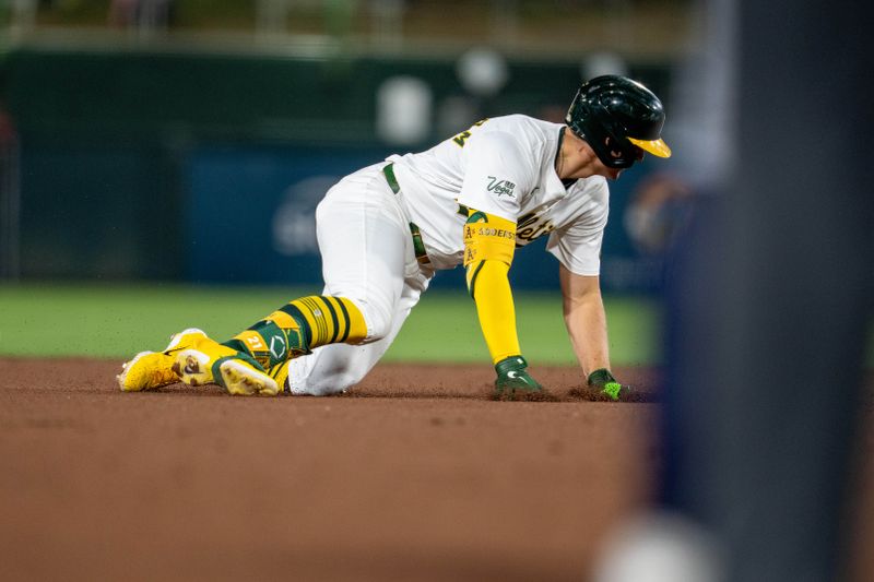 May 6, 2025; West Sacramento, California, USA;   Athletics left fielder Tyler Soderstrom (21) trying to round second base stumbles before going back to second base for a double against the Seattle Mariners during the sixth inning at Sutter Health Park. Mandatory Credit: Neville E. Guard-Imagn Images