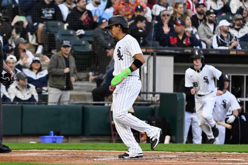 May 11, 2024; Chicago, Illinois, USA;  Chicago White Sox second baseman Nicky Lopez (8) scores against the Cleveland Guardians during the second inning at Guaranteed Rate Field. Mandatory Credit: Matt Marton-USA TODAY Sports