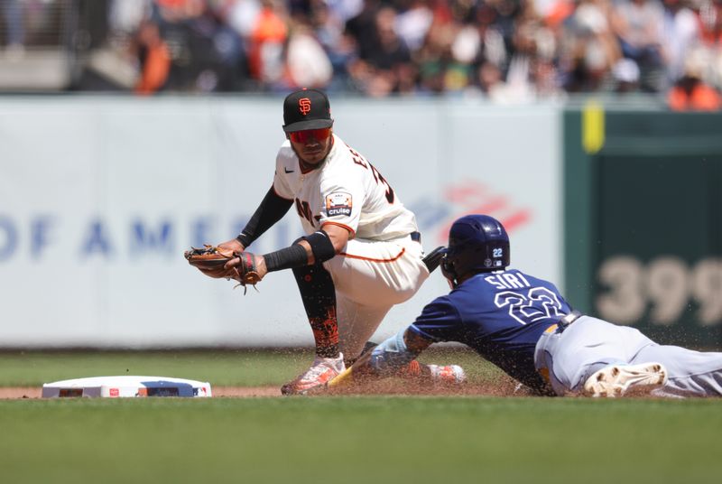 Aug 16, 2023; San Francisco, California, USA; Tampa Bay Rays center fielder Jose Siri (22) is tagged out at second base by San Francisco Giants second baseman Thairo Estrada (39) during the fourth inning at Oracle Park. Mandatory Credit: Sergio Estrada-USA TODAY Sports