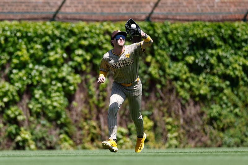 May 8, 2024; Chicago, Illinois, USA; San Diego Padres outfielder Jackson Merrill (3) catches a fly ball hit by Chicago Cubs outfielder Mike Tauchman during the first inning at Wrigley Field. Mandatory Credit: Kamil Krzaczynski-USA TODAY Sports