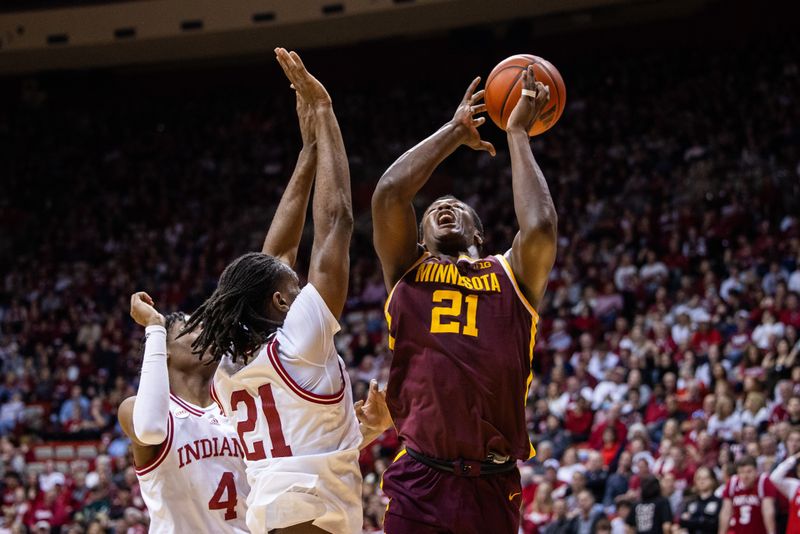 Jan 12, 2024; Bloomington, Indiana, USA; Minnesota Golden Gophers forward Pharrel Payne (21) shoots the ball while Indiana Hoosiers forward Mackenzie Mgbako (21) defends in the second half at Simon Skjodt Assembly Hall. Mandatory Credit: Trevor Ruszkowski-USA TODAY Sports