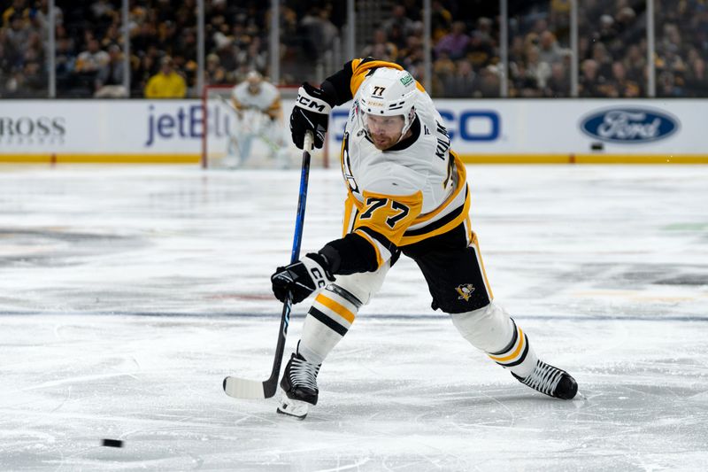 Jan 11, 2026; Boston, Massachusetts, USA; Pittsburgh Penguins defenseman Brett Kulak (77) shoots the puck during the second period of the game against the Boston Bruins at TD Garden. Mandatory Credit: Natalie Reid-Imagn Images