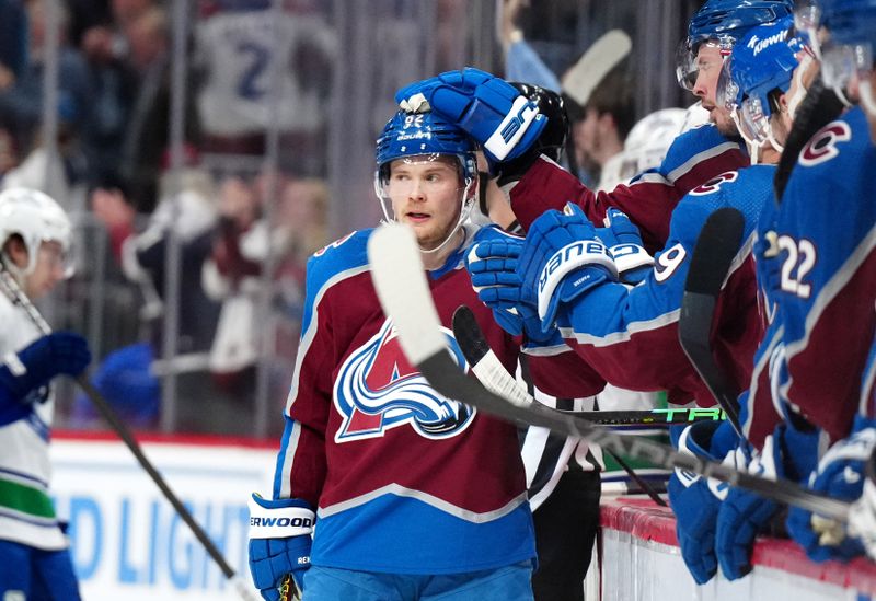 Feb 20, 2024; Denver, Colorado, USA; Colorado Avalanche left wing Artturi Lehkonen (62) celebrates his empty net goal in the third period against the Vancouver Canucks at Ball Arena. Mandatory Credit: Ron Chenoy-USA TODAY Sports