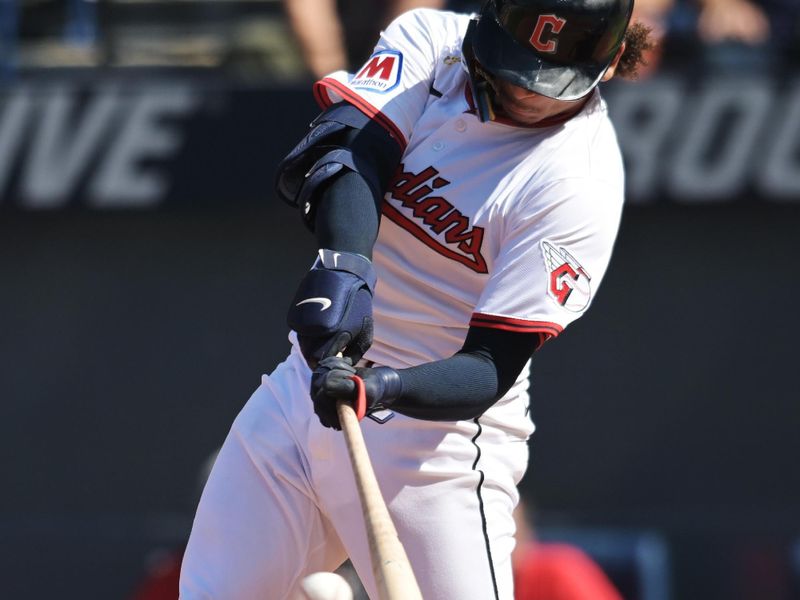 Sep 14, 2025; Cleveland, Ohio, USA; Cleveland Guardians catcher Bo Naylor (23) hits an RBI double against the Chicago White Sox during the fourth inning at Progressive Field. Mandatory Credit: Ken Blaze-Imagn Images