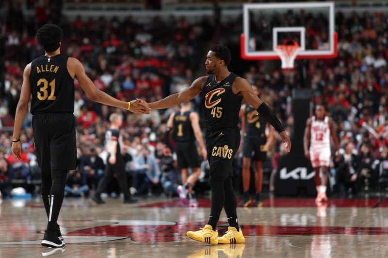 CHICAGO, IL - FEBRUARY 28: Jarrett Allen #31 and Donovan Mitchell #45 of the Cleveland Cavaliers high five during the game against the Chicago Bulls on February 28, 2024 at United Center in Chicago, Illinois. NOTE TO USER: User expressly acknowledges and agrees that, by downloading and or using this photograph, User is consenting to the terms and conditions of the Getty Images License Agreement. Mandatory Copyright Notice: Copyright 2024 NBAE (Photo by Jeff Haynes/NBAE via Getty Images)