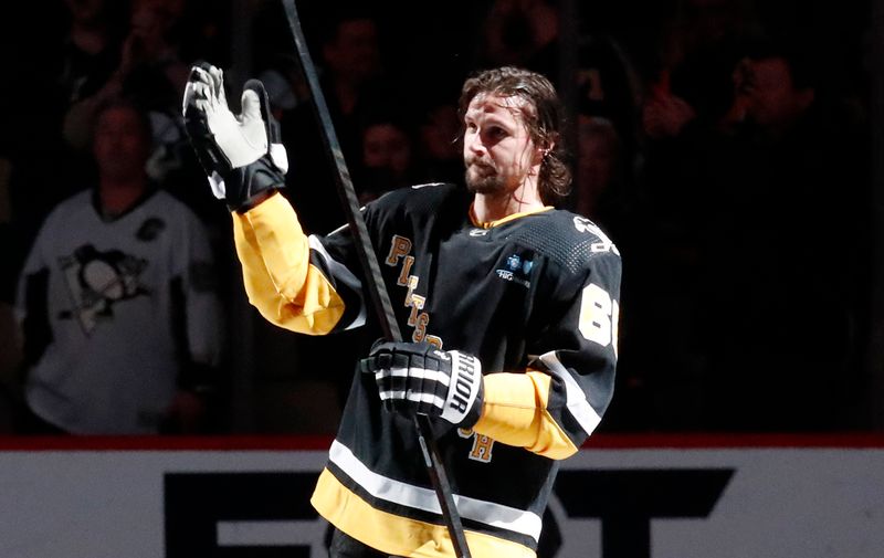 Apr 11, 2024; Pittsburgh, Pennsylvania, USA; Pittsburgh Penguins defenseman Erik Karlsson (65) reacts to being named first star of the game after scoring the game winning goal against the Detroit Red Wings in overtime at PPG Paints Arena. Pittsburgh won 6-5 in overtime. Mandatory Credit: Charles LeClaire-USA TODAY Sports