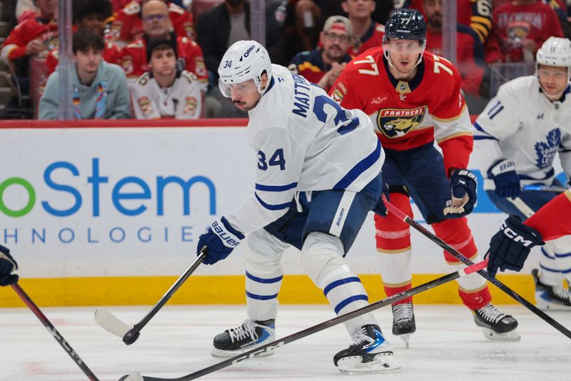 Dec 2, 2025; Sunrise, Florida, USA; Toronto Maple Leafs center Auston Matthews (34) moves the puck against the Florida Panthers during the second period at Amerant Bank Arena. Mandatory Credit: Sam Navarro-Imagn Images