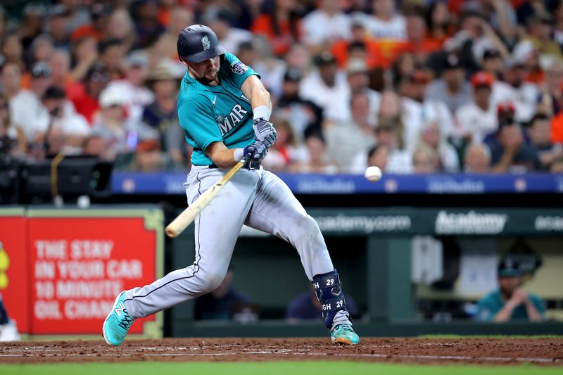 Aug 19, 2023; Houston, Texas, USA; Seattle Mariners catcher Cal Raleigh (29) hits an RBI single against the Houston Astros during the third inning at Minute Maid Park. Mandatory Credit: Erik Williams-USA TODAY Sports