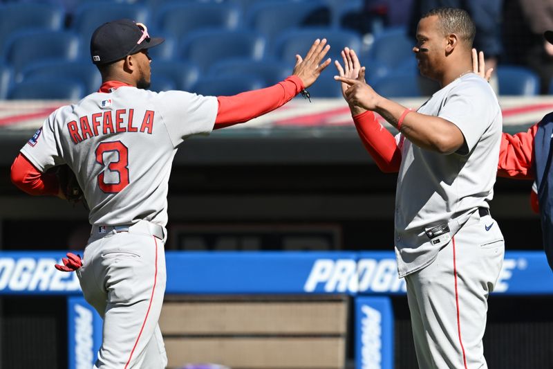 Apr 27, 2025; Cleveland, Ohio, USA; Boston Red Sox center fielder Ceddanne Rafaela (3) and designated hitter Rafael Devers (11) celebrate after the Red Sox beat the Cleveland Guardians at Progressive Field. Mandatory Credit: Ken Blaze-Imagn Images