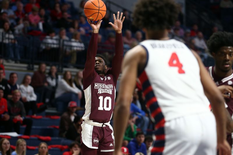 Feb 18, 2023; Oxford, Mississippi, USA; Mississippi State Bulldogs guard Dashawn Davis (10) shoots for three during the first half against the Mississippi Rebels at The Sandy and John Black Pavilion at Ole Miss. Mandatory Credit: Petre Thomas-USA TODAY Sports