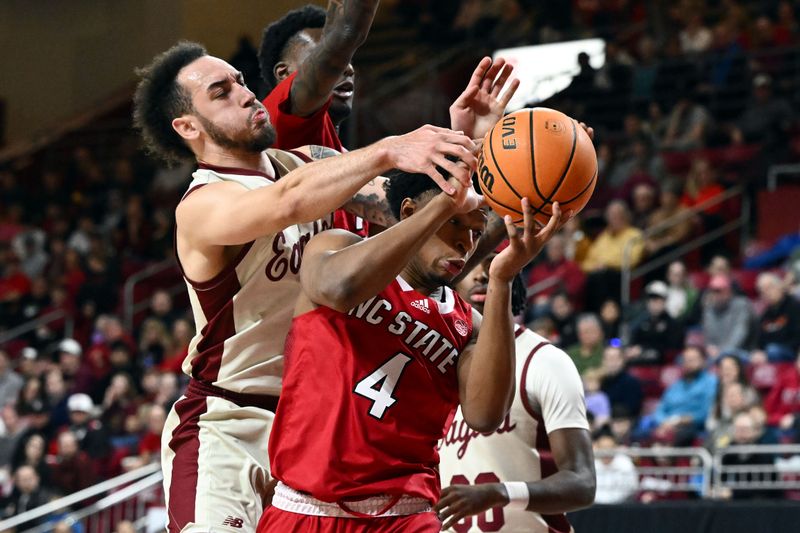 Feb 11, 2023; Chestnut Hill, Massachusetts, USA; Boston College Eagles guard Jaeden Zackery (3) defends North Carolina State Wolfpack guard LJ Thomas (4) during the first half at the Conte Forum. Mandatory Credit: Brian Fluharty-USA TODAY Sports