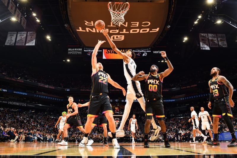 PHOENIX, AZ - DECEMBER 3: Victor Wembanyama #1 of the San Antonio Spurs drives to the basket during the game against the Phoenix Suns during a Emirates NBA Cup game on December 3, 2024 at Footprint Center in Phoenix, Arizona. NOTE TO USER: User expressly acknowledges and agrees that, by downloading and or using this photograph, user is consenting to the terms and conditions of the Getty Images License Agreement. Mandatory Copyright Notice: Copyright 2024 NBAE (Photo by Barry Gossage/NBAE via Getty Images)