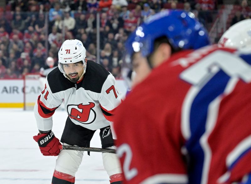 Jan 25, 2025; Montreal, Quebec, CAN; New Jersey Devils defenseman Jonas Siegenthaler (71) prepares for a face off  against the Montreal Canadiens during the first period at the Bell Centre. Mandatory Credit: Eric Bolte-Imagn Images