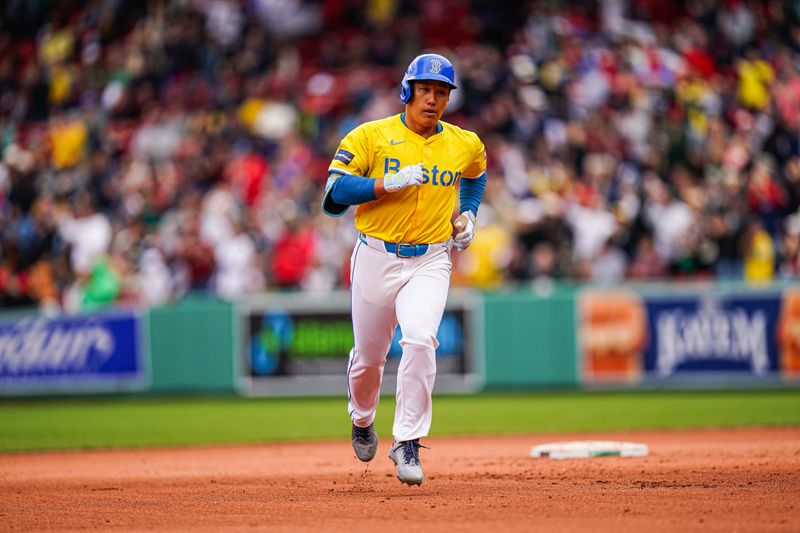 Apr 14, 2024; Boston, Massachusetts, USA; Boston Red Sox left fielder Masataka Yoshida (7) rounds the bases after hitting a two run home run against the Los Angeles Angels in the sixth inning at Fenway Park. Mandatory Credit: David Butler II-USA TODAY Sports