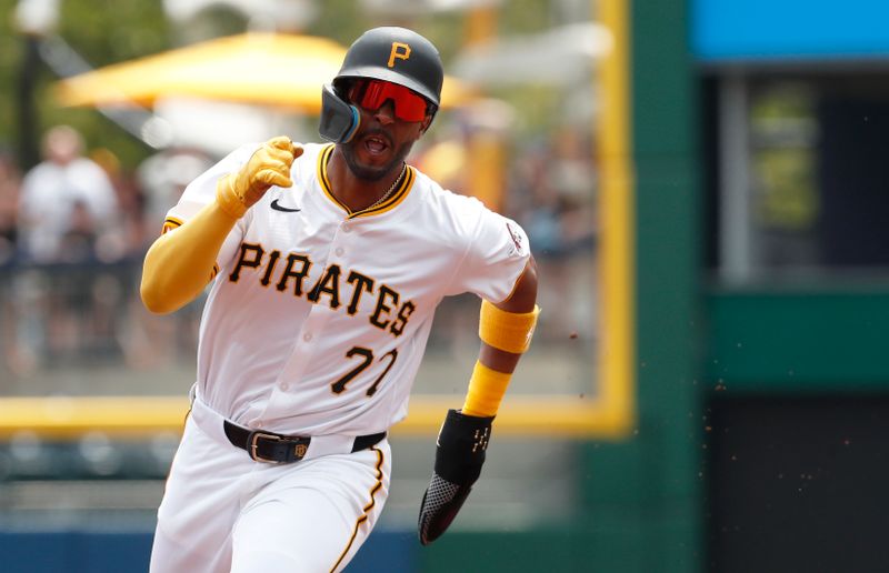 Jul 24, 2024; Pittsburgh, Pennsylvania, USA;  Pittsburgh Pirates left fielder Joshua Palacios (77) runs from first base to third base against the St. Louis Cardinals during the second inning at PNC Park. Mandatory Credit: Charles LeClaire-USA TODAY Sports