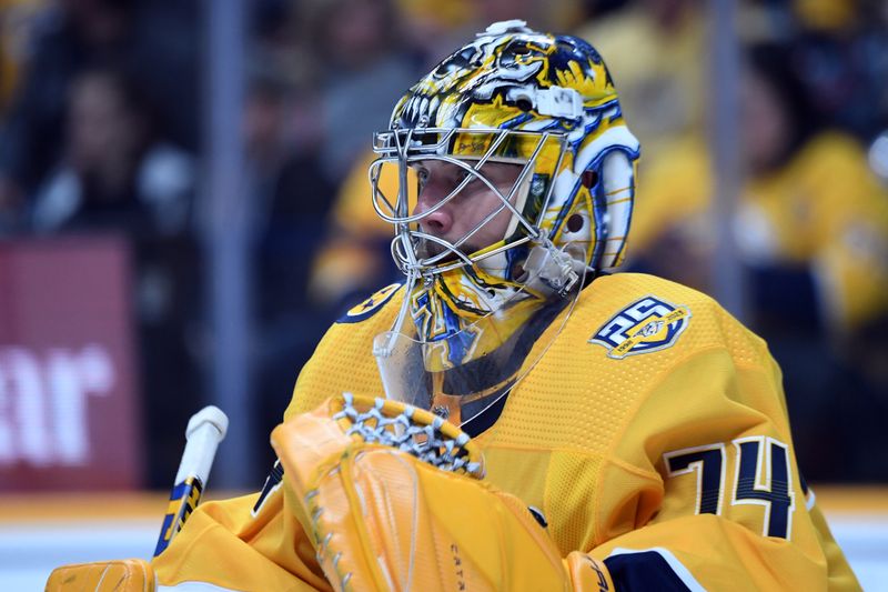 Apr 4, 2024; Nashville, Tennessee, USA; Nashville Predators goaltender Juuse Saros (74) watches the puck during the second period against the St. Louis Blues at Bridgestone Arena. Mandatory Credit: Christopher Hanewinckel-USA TODAY Sports