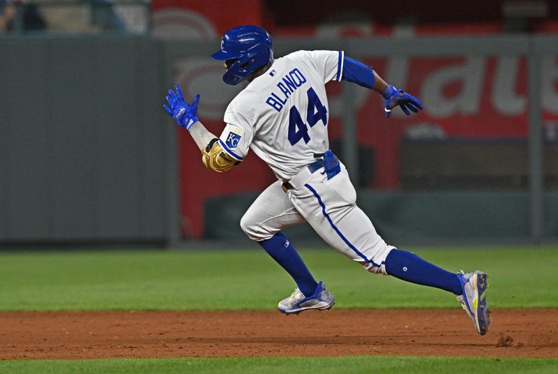 Jun 14, 2023; Kansas City, Missouri, USA;  Kansas City Royals center fielder Dairon Blanco (44) triples in the eighth inning against the Cincinnati Reds at Kauffman Stadium. Mandatory Credit: Peter Aiken-USA TODAY Sports