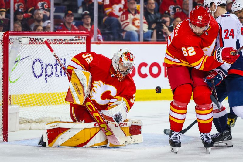 Mar 18, 2024; Calgary, Alberta, CAN; Calgary Flames goaltender Dustin Wolf (32) makes a save against the Washington Capitals during the third period at Scotiabank Saddledome. Mandatory Credit: Sergei Belski-USA TODAY Sports