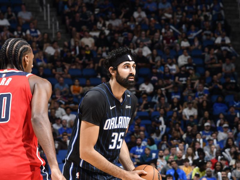 ORLANDO, FL - NOVMEBER 10: Goga Bitadze #35 of the Orlando Magic looks to pass the ball during the game against the Washington Wizards on November 10, 2024 at Kia Center in Orlando, Florida. NOTE TO USER: User expressly acknowledges and agrees that, by downloading and or using this photograph, User is consenting to the terms and conditions of the Getty Images License Agreement. Mandatory Copyright Notice: Copyright 2024 NBAE (Photo by Fernando Medina/NBAE via Getty Images)