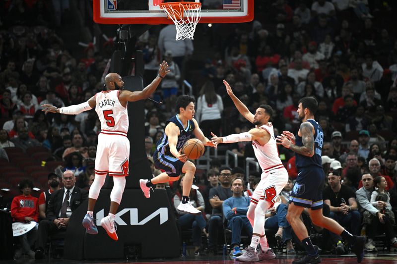 CHICAGO, ILLINOIS - OCTOBER 12: Yuki Kawamura #17 of the Memphis Grizzlies passes the ball in the first half of a preseason game against the Chicago Bulls at the United Center on October 12, 2024 in Chicago, Illinois.  NOTE TO USER: User expressly acknowledges and agrees that, by downloading and or using this photograph, User is consenting to the terms and conditions of the Getty Images License Agreement. (Photo by Quinn Harris/Getty Images)