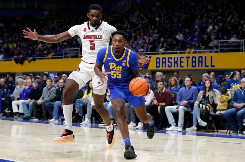 Feb 17, 2024; Pittsburgh, Pennsylvania, USA;  Pittsburgh Panthers forward Zack Austin (55) drives to the basket past Louisville Cardinals forward Brandon Huntley-Hatfield (5) during the second half at the Petersen Events Center. Pittsburgh won 86-59. Mandatory Credit: Charles LeClaire-USA TODAY Sports