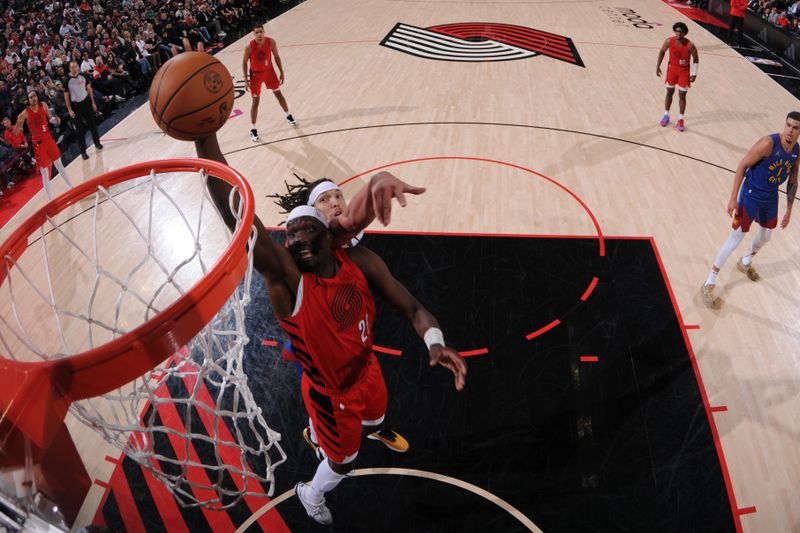 PORTLAND, OR - MARCH 23: Duop Reath #26 of the Portland Trail Blazers shoots the ball during the game against the Denver Nuggets on March 23, 2024 at the Moda Center Arena in Portland, Oregon. NOTE TO USER: User expressly acknowledges and agrees that, by downloading and or using this photograph, user is consenting to the terms and conditions of the Getty Images License Agreement. Mandatory Copyright Notice: Copyright 2024 NBAE (Photo by Cameron Browne/NBAE via Getty Images)