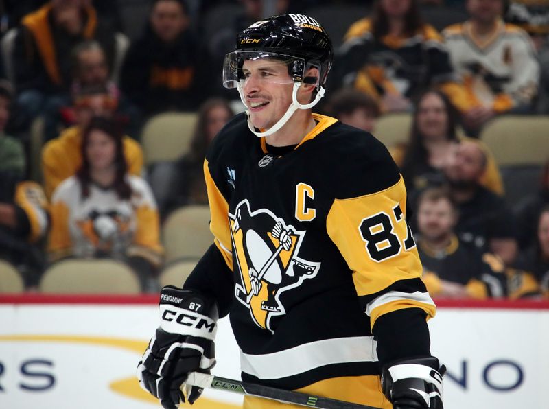 Oct 31, 2024; Pittsburgh, Pennsylvania, USA;  Pittsburgh Penguins center Sidney Crosby (87) reacts during the first period against the Anaheim Ducks at PPG Paints Arena. Mandatory Credit: Charles LeClaire-Imagn Images