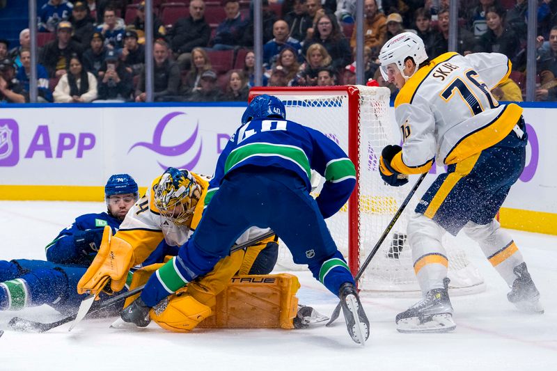 Nov 17, 2024; Vancouver, British Columbia, CAN; Vancouver Canucks forward Jake DeBrusk (74) and Nashville Predators defenseman Brady Skjei (76) watch as goalie Juuse Saros (74) makes a save on forward Elias Pettersson (40) during the first period at Rogers Arena. Mandatory Credit: Bob Frid-Imagn Images