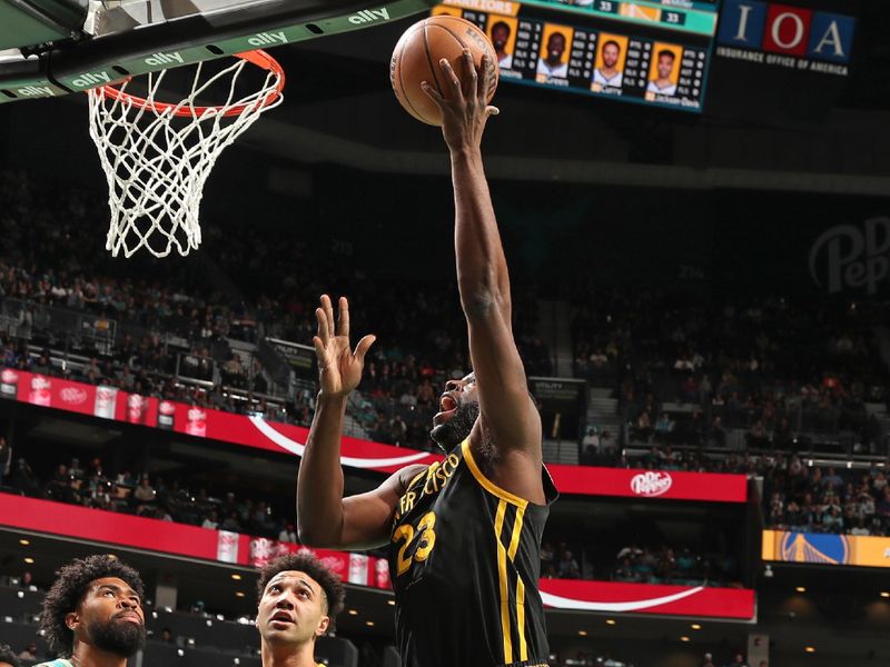 CHARLOTTE, NC - MARCH 29: Draymond Green #23 of the Golden State Warriors drives to the basket during the game against the Charlotte Hornets on March 29, 2024 at Spectrum Center in Charlotte, North Carolina. NOTE TO USER: User expressly acknowledges and agrees that, by downloading and or using this photograph, User is consenting to the terms and conditions of the Getty Images License Agreement. Mandatory Copyright Notice: Copyright 2024 NBAE (Photo by Kent Smith/NBAE via Getty Images)