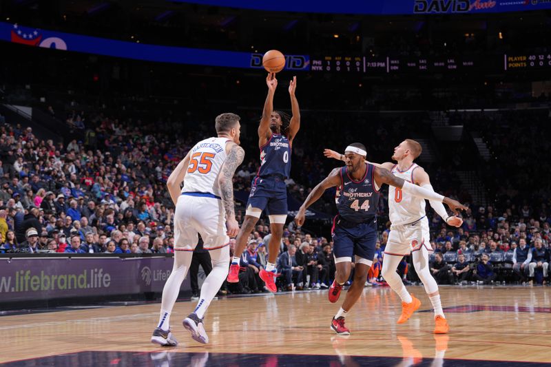 PHILADELPHIA, PA - FEBRUARY 22: Tyrese Maxey #0 of the Philadelphia 76ers shoots a three point basket against the New York Knicks on February 22, 2024 at the Wells Fargo Center in Philadelphia, Pennsylvania NOTE TO USER: User expressly acknowledges and agrees that, by downloading and/or using this Photograph, user is consenting to the terms and conditions of the Getty Images License Agreement. Mandatory Copyright Notice: Copyright 2024 NBAE (Photo by Jesse D. Garrabrant/NBAE via Getty Images)