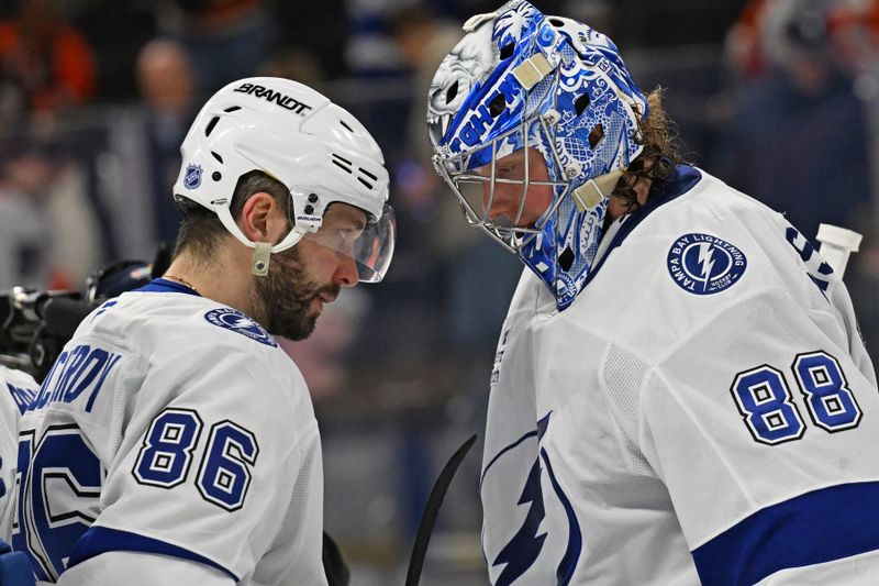Jan 10, 2026; Philadelphia, Pennsylvania, USA; Tampa Bay Lightning right wing Nikita Kucherov (86) and goaltender Andrei Vasilevskiy (88) celebrate win  against the Philadelphia Flyers during the third period at Xfinity Mobile Arena. Mandatory Credit: Eric Hartline-Imagn Images