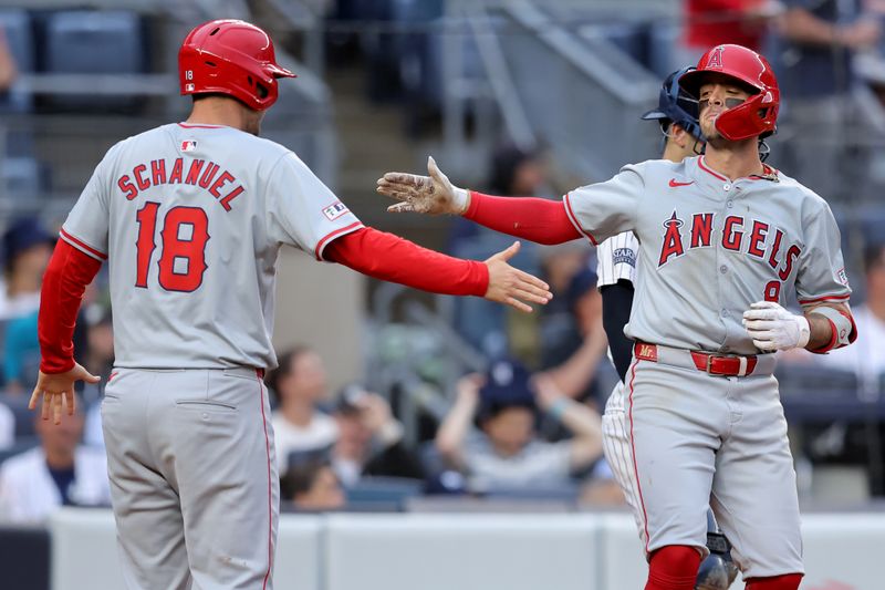 Aug 7, 2024; Bronx, New York, USA; Los Angeles Angels shortstop Zach Neto (9) celebrates his two run home run against the New York Yankees with first baseman Nolan Schanuel (18) during the seventh inning at Yankee Stadium. Mandatory Credit: Brad Penner-USA TODAY Sports