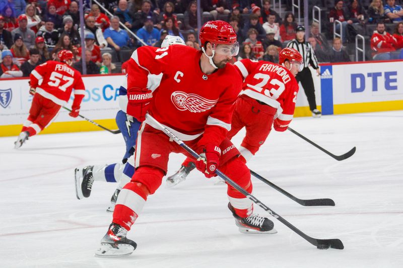 Jan 21, 2024; Detroit, Michigan, USA; Detroit Red Wings center Dylan Larkin (71) handles the puck during the first period at Little Caesars Arena. Mandatory Credit: Brian Bradshaw Sevald-USA TODAY Sports