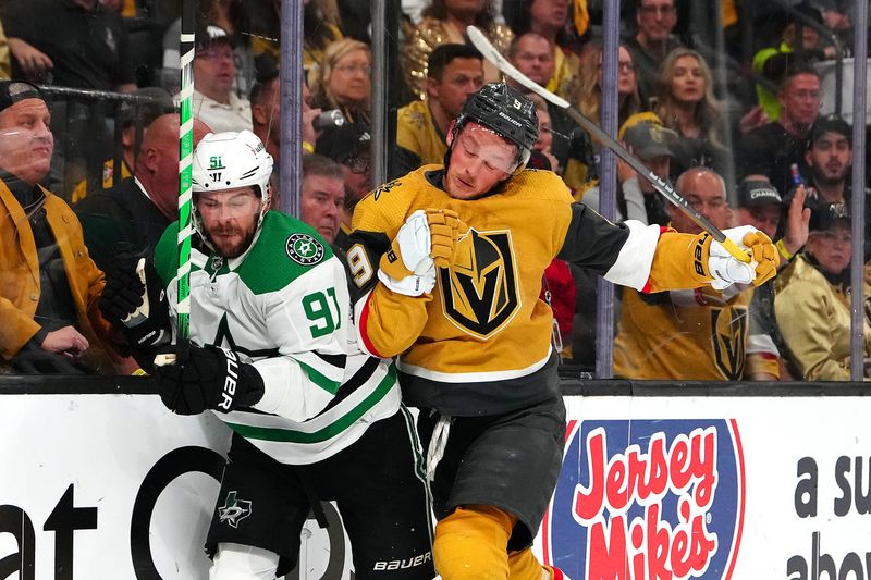 May 3, 2024; Las Vegas, Nevada, USA; Vegas Golden Knights center Jack Eichel (9) checks Dallas Stars center Tyler Seguin (91) during the second period of game six of the first round of the 2024 Stanley Cup Playoffs at T-Mobile Arena. Mandatory Credit: Stephen R. Sylvanie-USA TODAY Sports