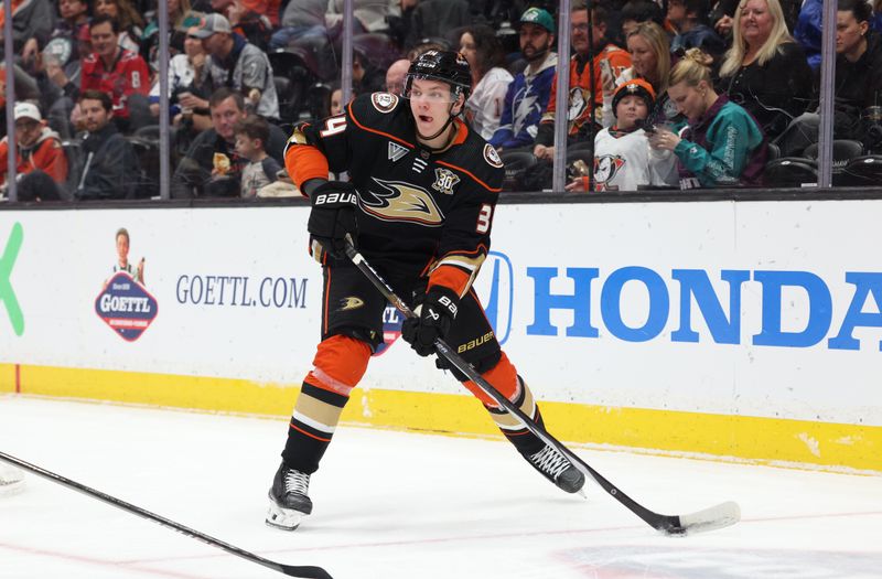 Mar 24, 2024; Anaheim, California, USA; Anaheim Ducks defenseman Pavel Mintyukov (34) passes during the first period against the Tampa Bay Lightning at Honda Center. Mandatory Credit: Jason Parkhurst-USA TODAY Sports