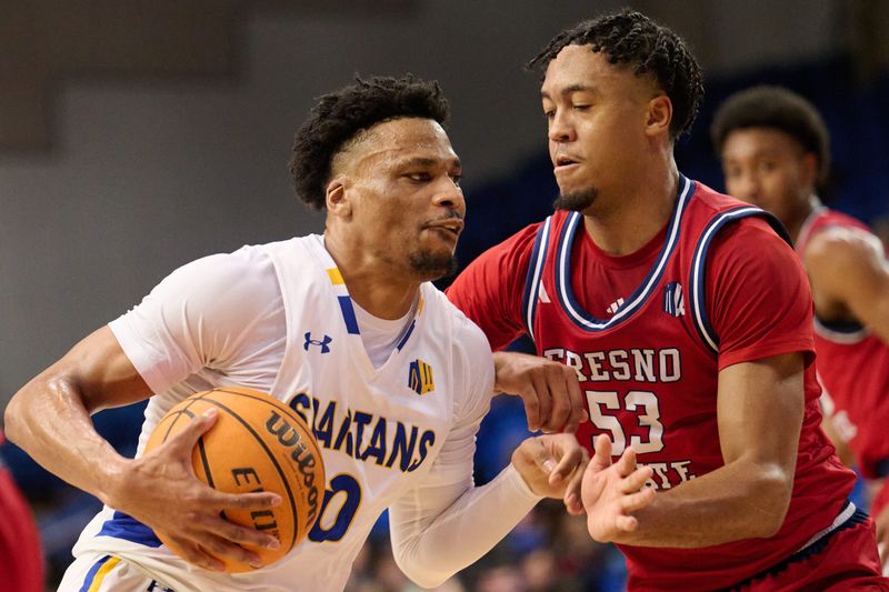 Feb 6, 2024; San Jose, California, USA; San Jose State Spartans guard Myron Amey Jr. (0) dribbles the ball against Fresno State Bulldogs guard Xavier DuSell (53) during the first half at Provident Credit Union Event Center. Mandatory Credit: Robert Edwards-USA TODAY Sports