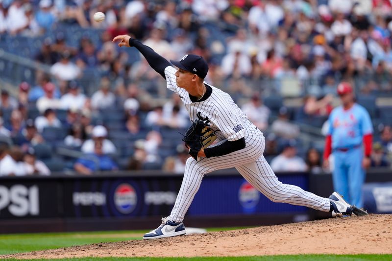 Aug 31, 2024; Bronx, New York, USA; New York Yankees pitcher Luke Weaver (30) delivers a pitch against the St. Louis Cardinals during the ninth inning at Yankee Stadium. Mandatory Credit: Gregory Fisher-USA TODAY Sports