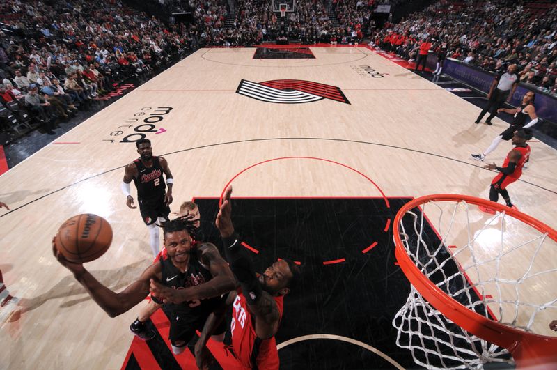 PORTLAND, OR - APRIL 12: Jabari Walker #34 of the Portland Trail Blazers drives to the basket during the game against the Houston Rockets on April 12, 2024 at the Moda Center Arena in Portland, Oregon. NOTE TO USER: User expressly acknowledges and agrees that, by downloading and or using this photograph, user is consenting to the terms and conditions of the Getty Images License Agreement. Mandatory Copyright Notice: Copyright 2024 NBAE (Photo by Cameron Browne/NBAE via Getty Images)