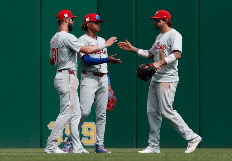 Jul 21, 2024; Pittsburgh, Pennsylvania, USA;  Philadelphia Phillies left fielder Weston Wilson (37) and center fielder  Cristian Pache (middle) and right fielder Nick Castellanos (right) celebrate in the outfield after defeating the Pittsburgh Pirates at PNC Park. The Phillies won 6-0.  Mandatory Credit: Charles LeClaire-USA TODAY Sports