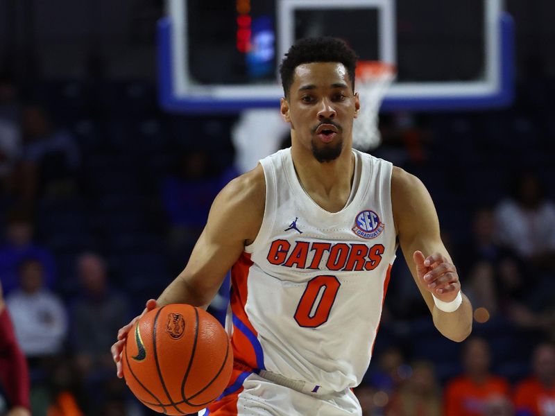 Jan 25, 2023; Gainesville, Florida, USA; Florida Gators guard Myreon Jones (0) drives to the basket against the South Carolina Gamecocks during the second half at Exactech Arena at the Stephen C. O'Connell Center. Mandatory Credit: Kim Klement-USA TODAY Sports