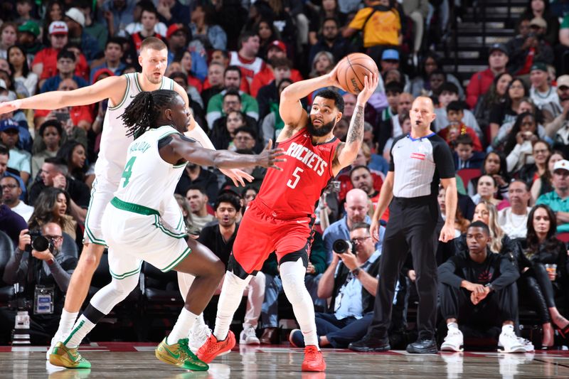 HOUSTON, TX - JANUARY 3:  Fred VanVleet #5 of the Houston Rockets looks to pass the ball during the game against the Boston Celtics on January 3, 2025 at the Toyota Center in Houston, Texas. NOTE TO USER: User expressly acknowledges and agrees that, by downloading and or using this photograph, User is consenting to the terms and conditions of the Getty Images License Agreement. Mandatory Copyright Notice: Copyright 2025 NBAE (Photo by Logan Riely/NBAE via Getty Images)