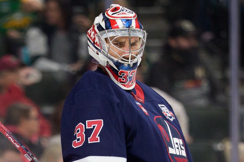 Oct 28, 2025; Saint Paul, Minnesota, USA; Winnipeg Jets goaltender Connor Hellebuyck (37) watches players line up for the faceoff in the second period against the Minnesota Wild at Grand Casino Arena. Mandatory Credit: Matt Blewett-Imagn Images