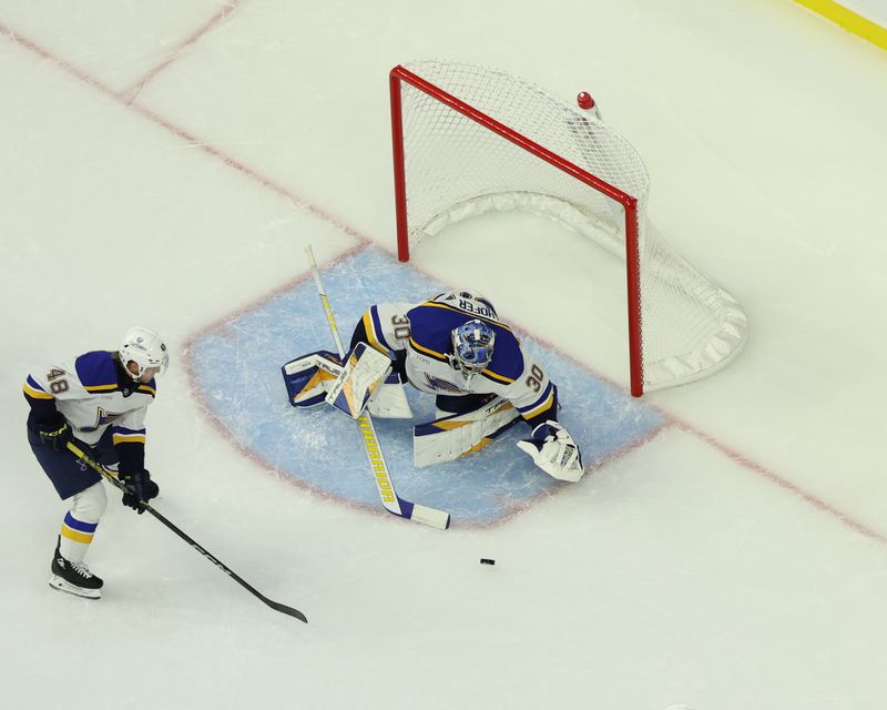 Sep 22, 2024; Des Moines, Iowa, USA; St. Louis Blues goaltender Joel Hofer (30) makes a save against the Utah Hockey Club at Wells Fargo Arena. Mandatory Credit: Reese Strickland-Imagn Images

