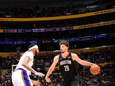 LOS ANGELES, CA - DECEMBER 2:  Alperen Sengun #28 of the Houston Rockets handles the ball during the game  on December 2, 2023 at Crypto.Com Arena in Los Angeles, California. NOTE TO USER: User expressly acknowledges and agrees that, by downloading and/or using this Photograph, user is consenting to the terms and conditions of the Getty Images License Agreement. Mandatory Copyright Notice: Copyright 2023 NBAE (Photo by Adam Pantozzi/NBAE via Getty Images)