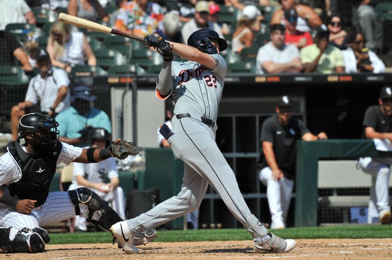 Aug 25, 2024; Chicago, Illinois, USA; Detroit Tigers center fielder Parker Meadows (22) hits an RBI triple during the fourth inning against the Chicago White Sox at Guaranteed Rate Field. Mandatory Credit: Patrick Gorski-USA TODAY Sports