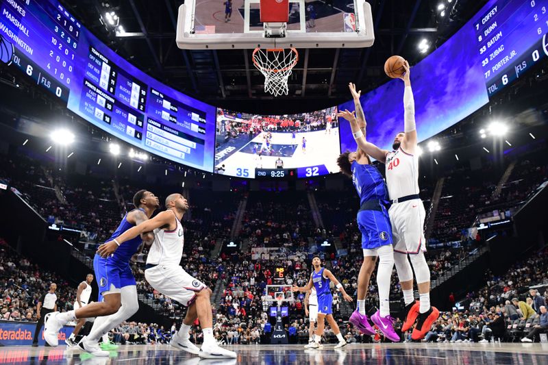 INGLEWOOD, CA - OCTOBER 14: Ivica Zubac #40 of the LA Clippers drives to the basket during the game against the Dallas Mavericks during a NBA Preseason game on October 14, 2024 at the Intuit Dome in Inglewood, California. NOTE TO USER: User expressly acknowledges and agrees that, by downloading and/or using this Photograph, user is consenting to the terms and conditions of the Getty Images License Agreement. Mandatory Copyright Notice: Copyright 2024 NBAE (Photo by Adam Pantozzi/NBAE via Getty Images)