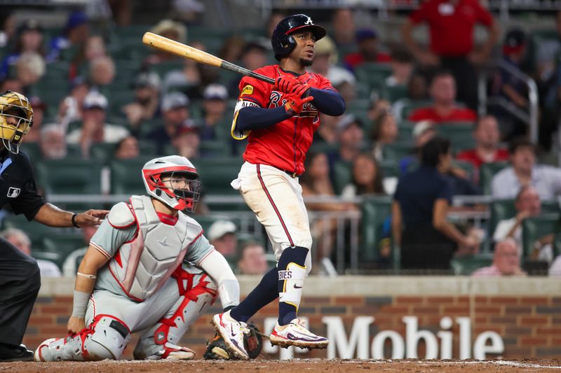 Jul 5, 2024; Atlanta, Georgia, USA; Atlanta Braves second baseman Ozzie Albies (1) hits a home run against the Philadelphia Phillies in the sixth inning at Truist Park. Mandatory Credit: Brett Davis-USA TODAY Sports