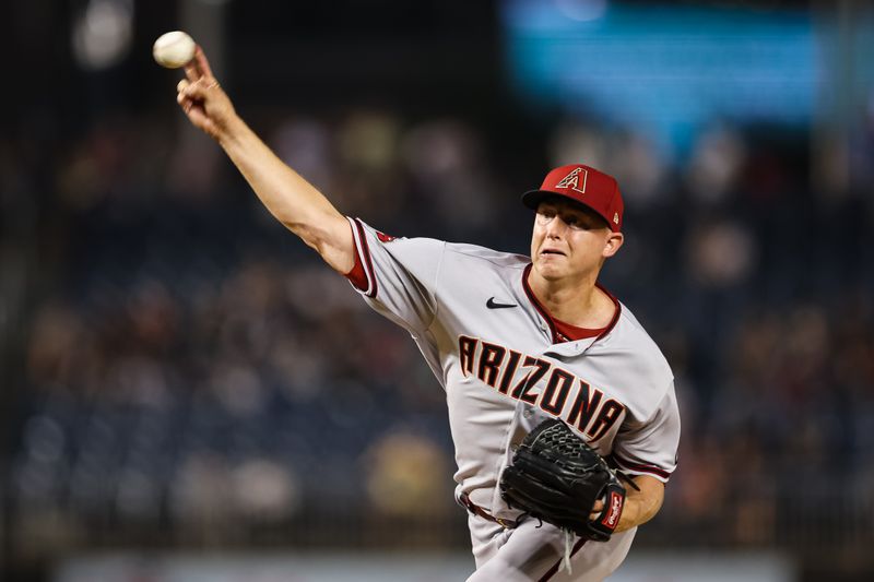 Jun 7, 2023; Washington, District of Columbia, USA; Arizona Diamondbacks relief pitcher Scott McGough (30) pitches against the Washington Nationals during the eighth inning at Nationals Park. Mandatory Credit: Scott Taetsch-USA TODAY Sports