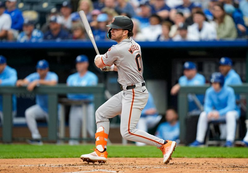 Sep 22, 2024; Kansas City, Missouri, USA; San Francisco Giants second baseman Brett Wisely (0) hits an RBI single during the second inning against the Kansas City Royals at Kauffman Stadium. Mandatory Credit: Jay Biggerstaff-Imagn Images