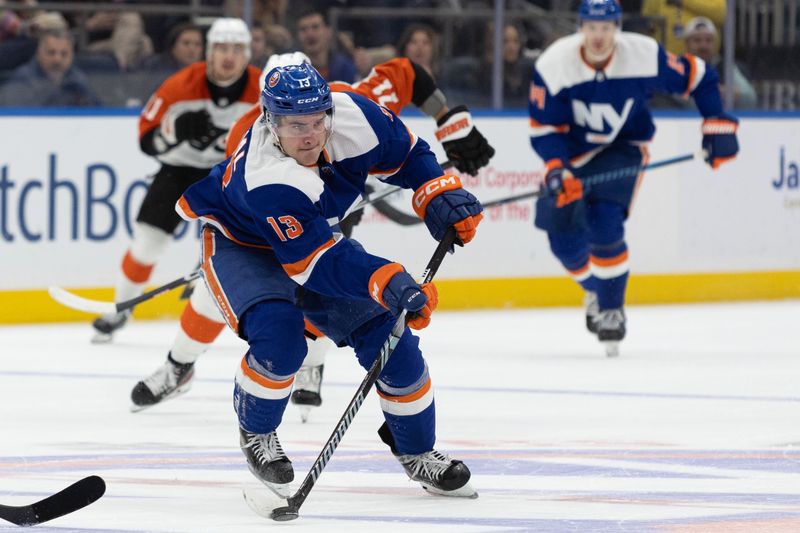 Nov 25, 2023; Elmont, New York, USA; New York Islanders center Mathew Barzal (13) makes a pass against the Philadelphia Flyers during the second period at UBS Arena. Mandatory Credit: Thomas Salus-USA TODAY Sports